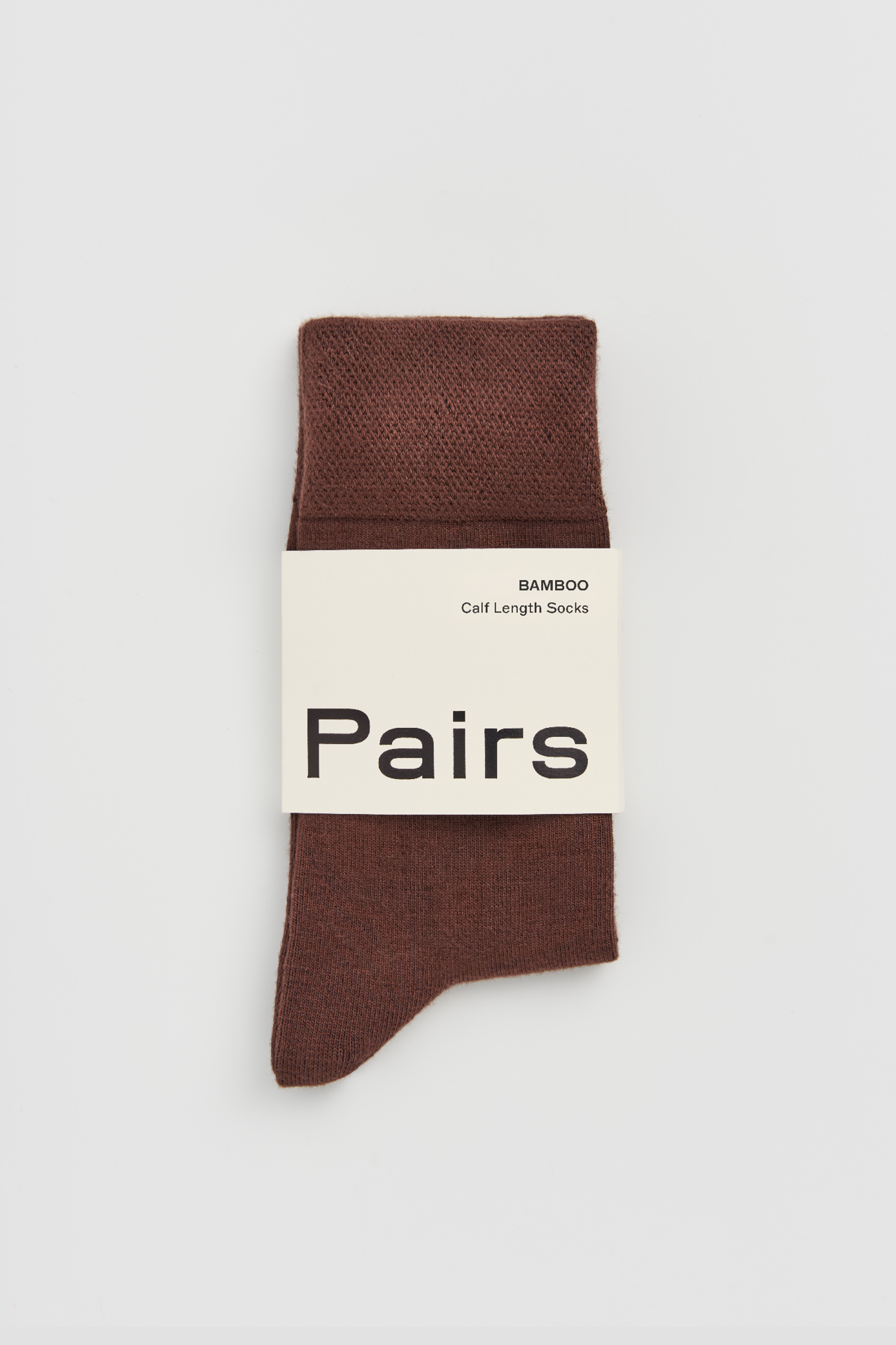 Brown sock with 'Pairs' packaging on a white background