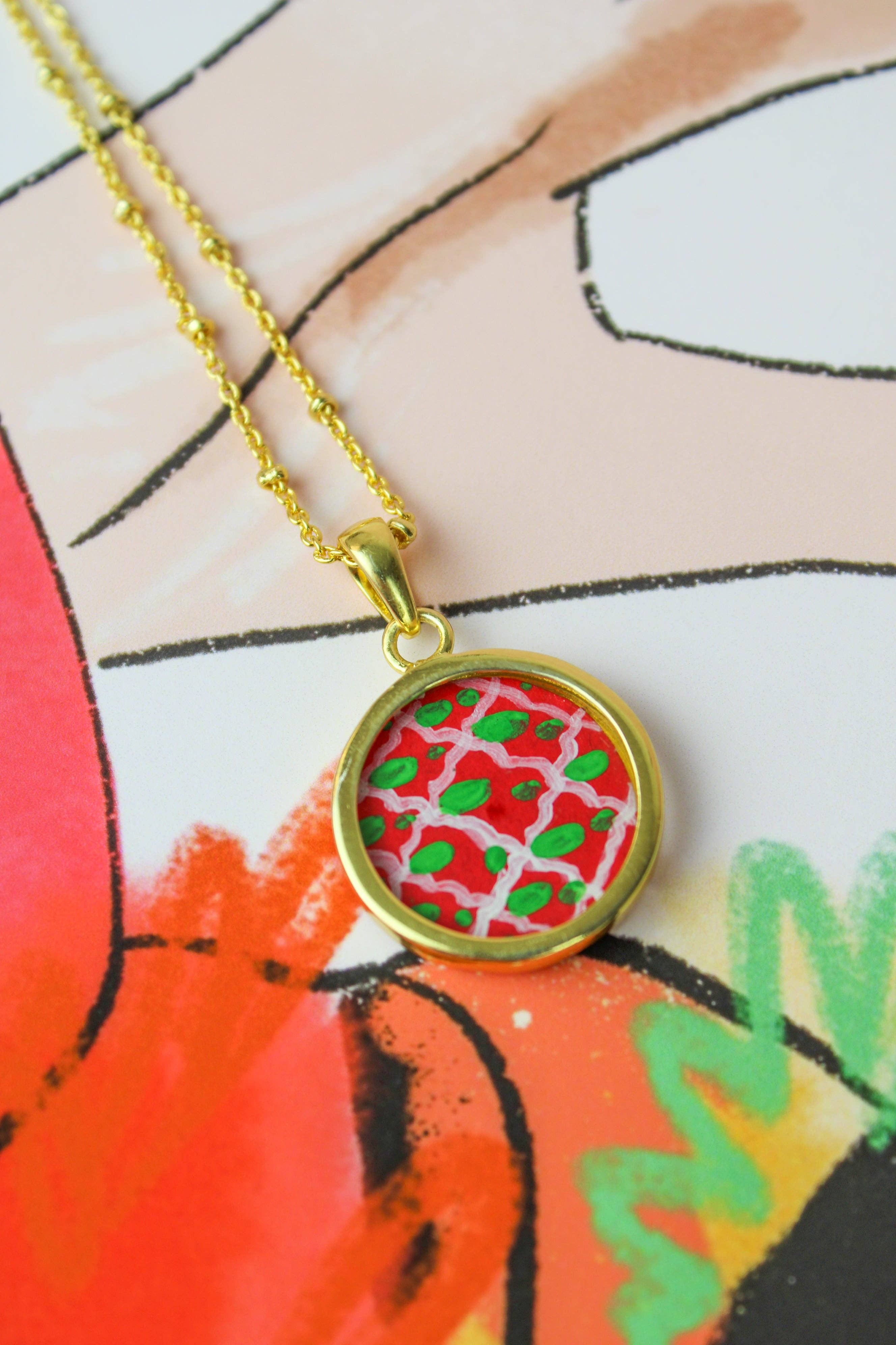 Necklace with a colorful pendant on a colorful background