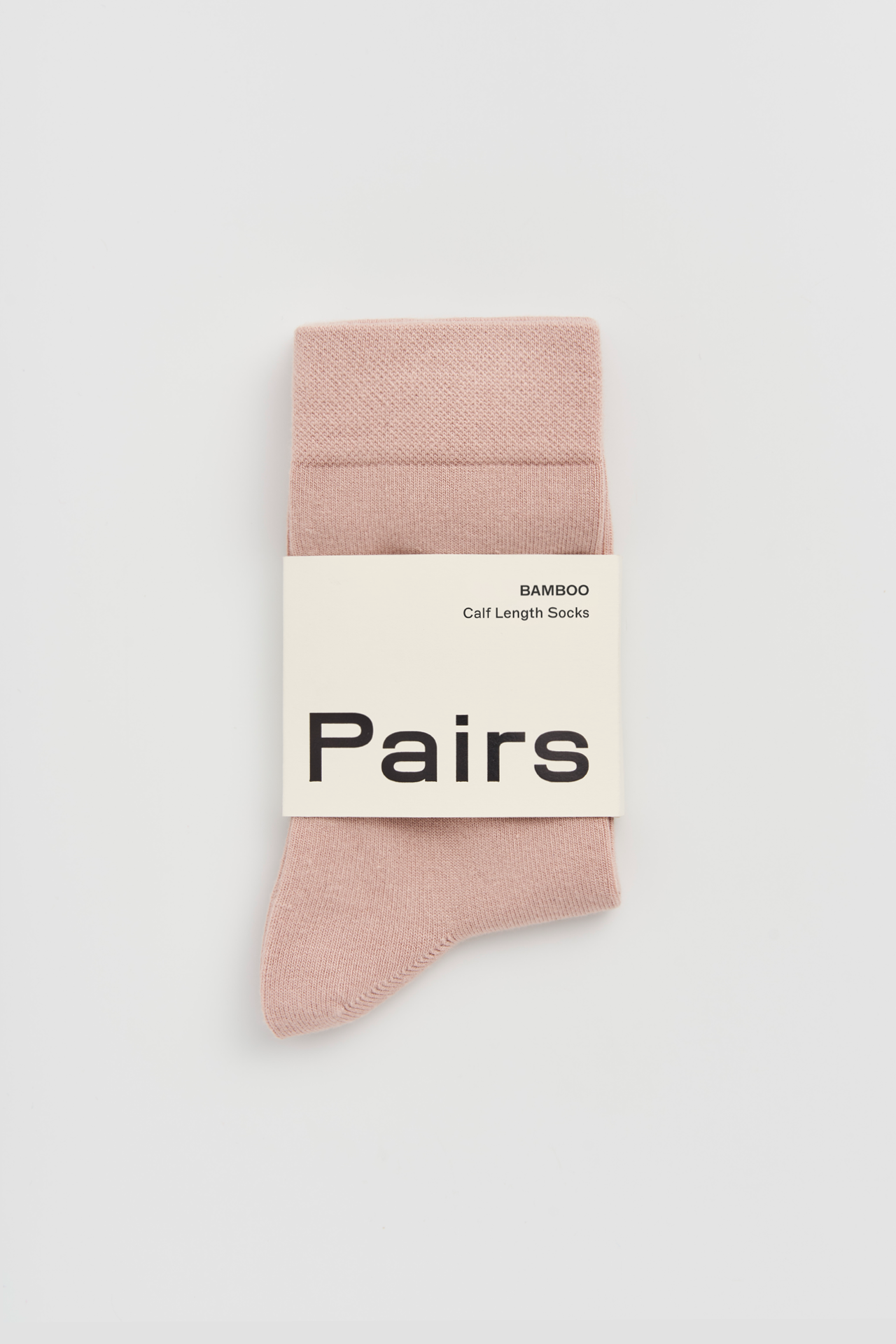 Pack of pink socks with a 'Pairs' label on a white background