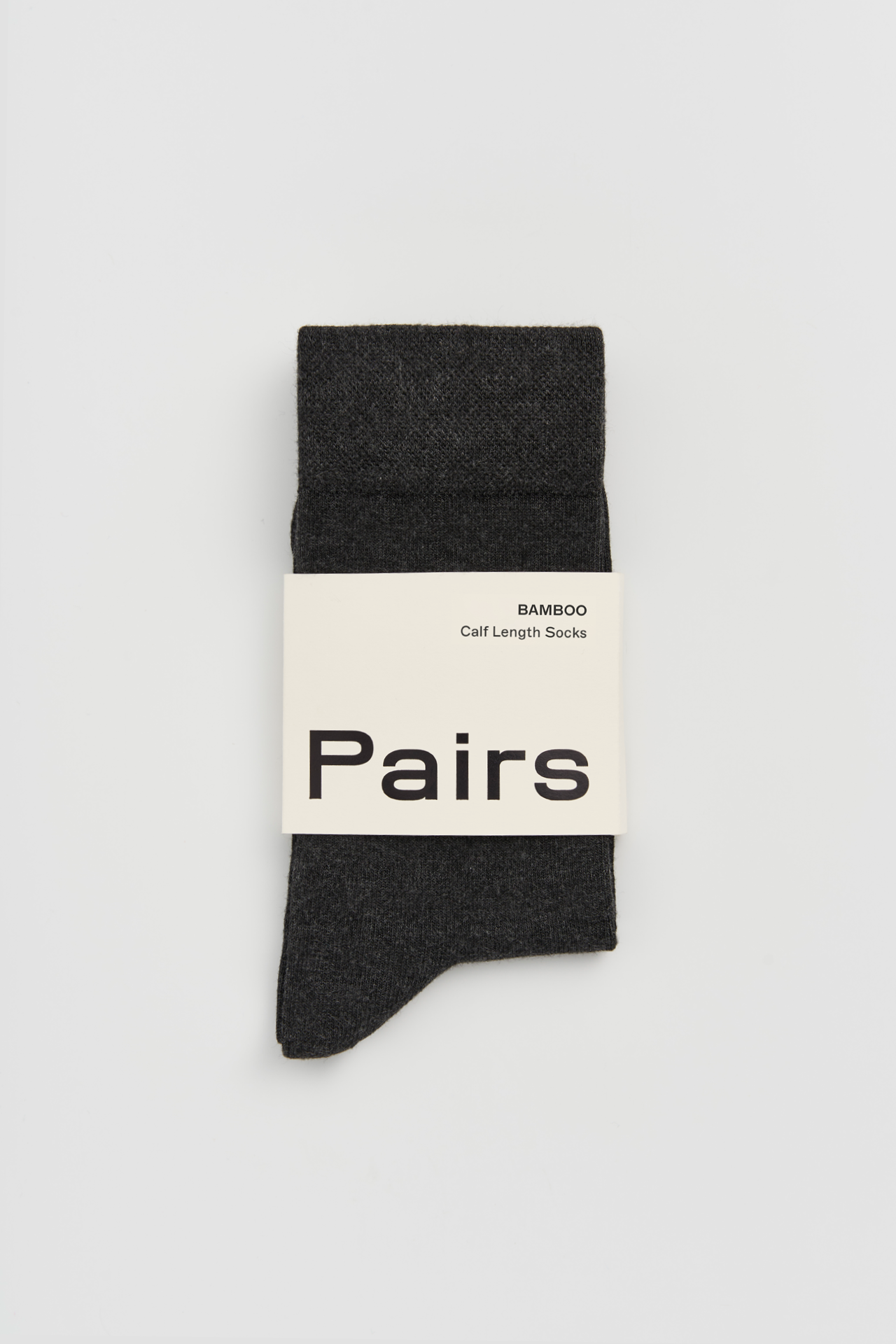Black sock with 'Pairs' label on a light gray background