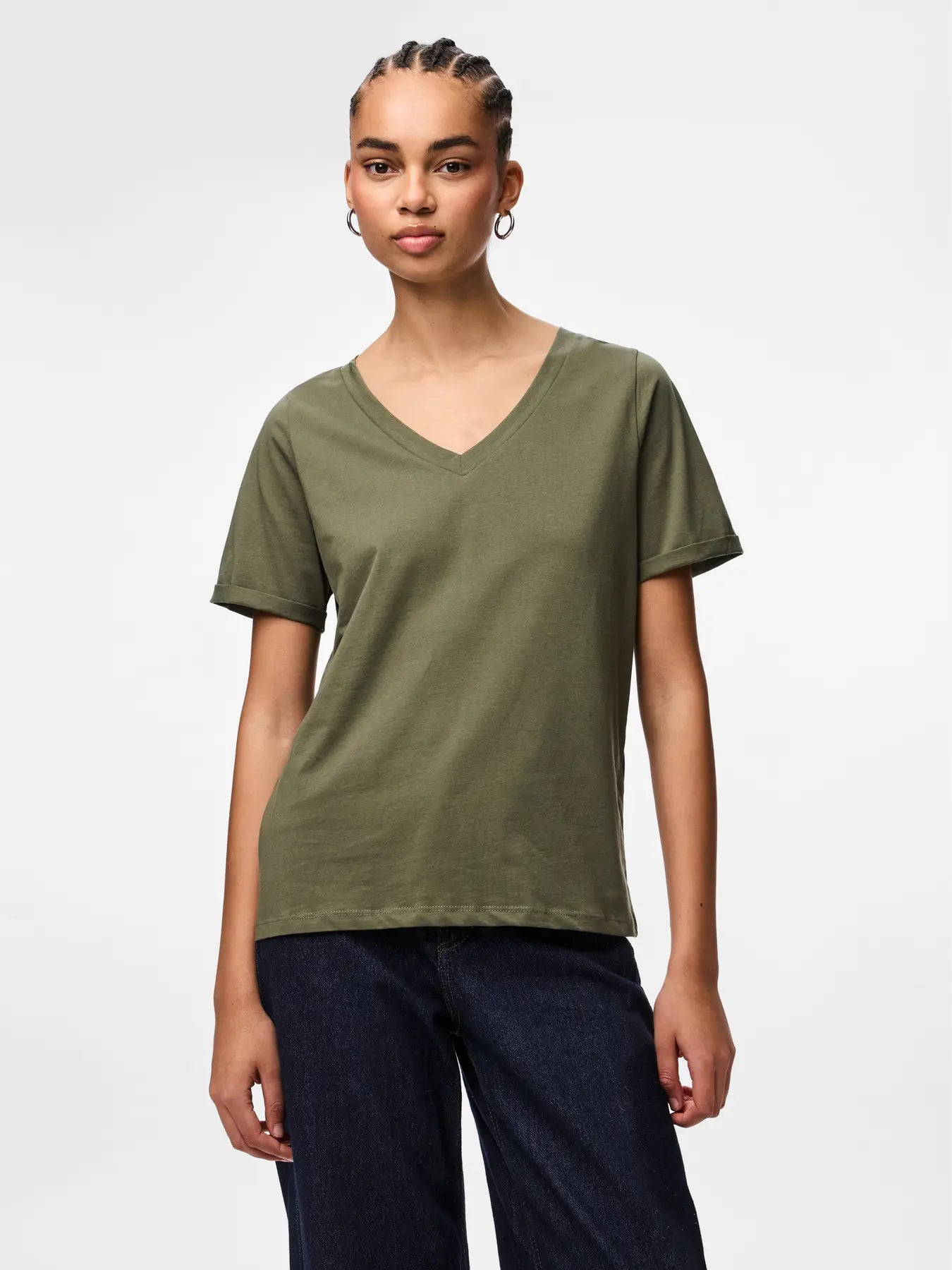 Person wearing an olive green t-shirt on a white background