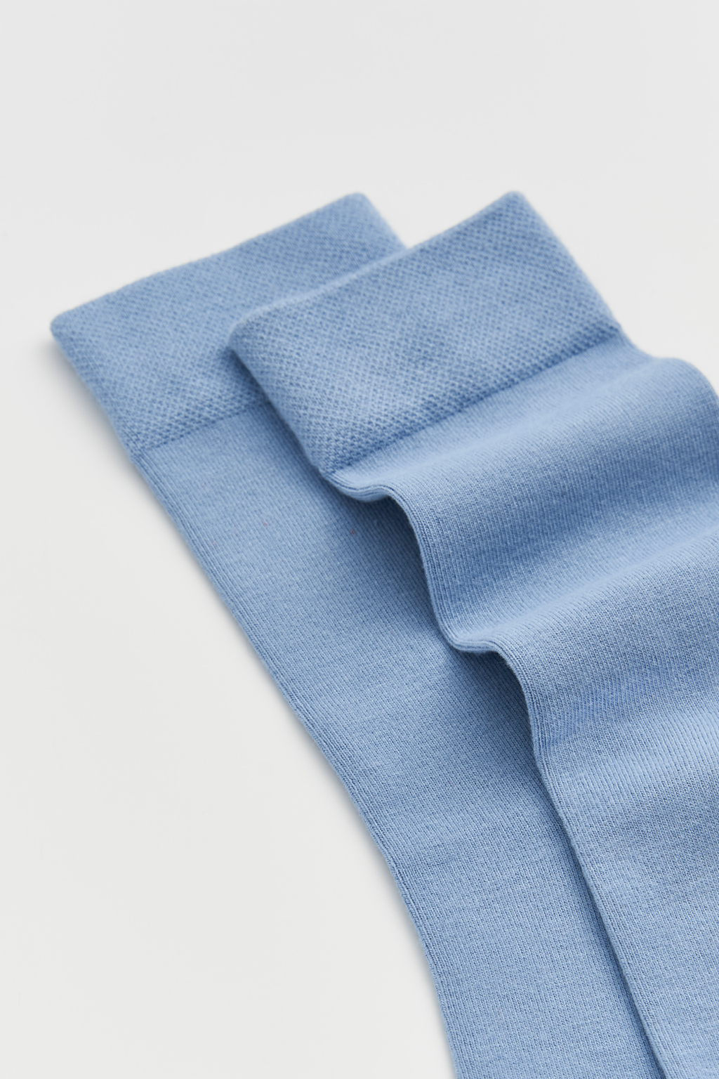 Light blue fabric on a light gray background