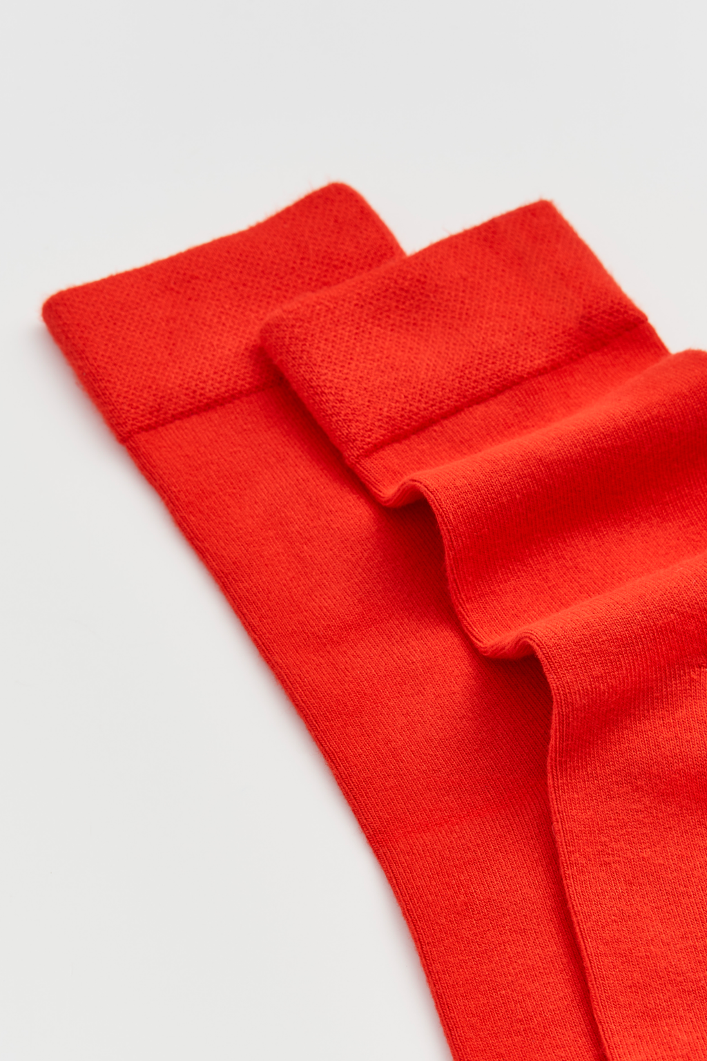 Red fabric on a light gray background
